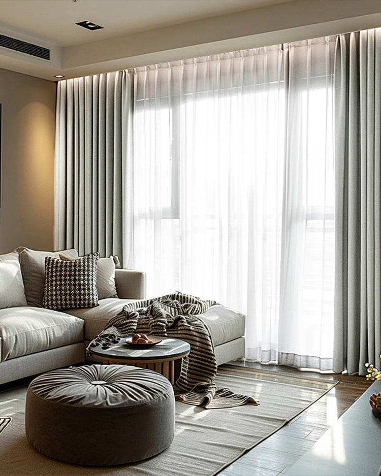 Modern living room with Cronin Linen Look blackout custom curtains and sheer panels, balancing privacy and light control.