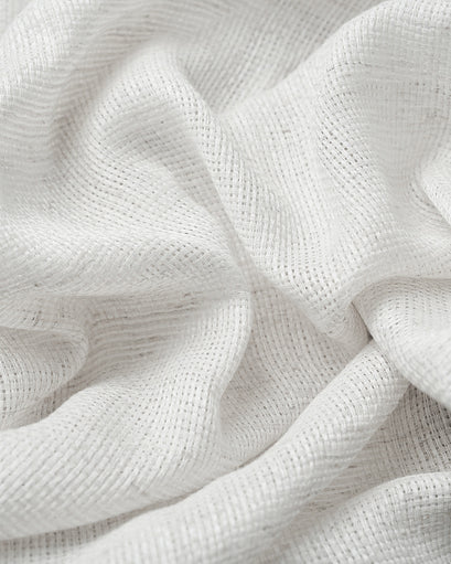 Close-up of white Wengen linen & cotton blend custom curtain fabric, highlighting its airy sheer weave and delicate texture.