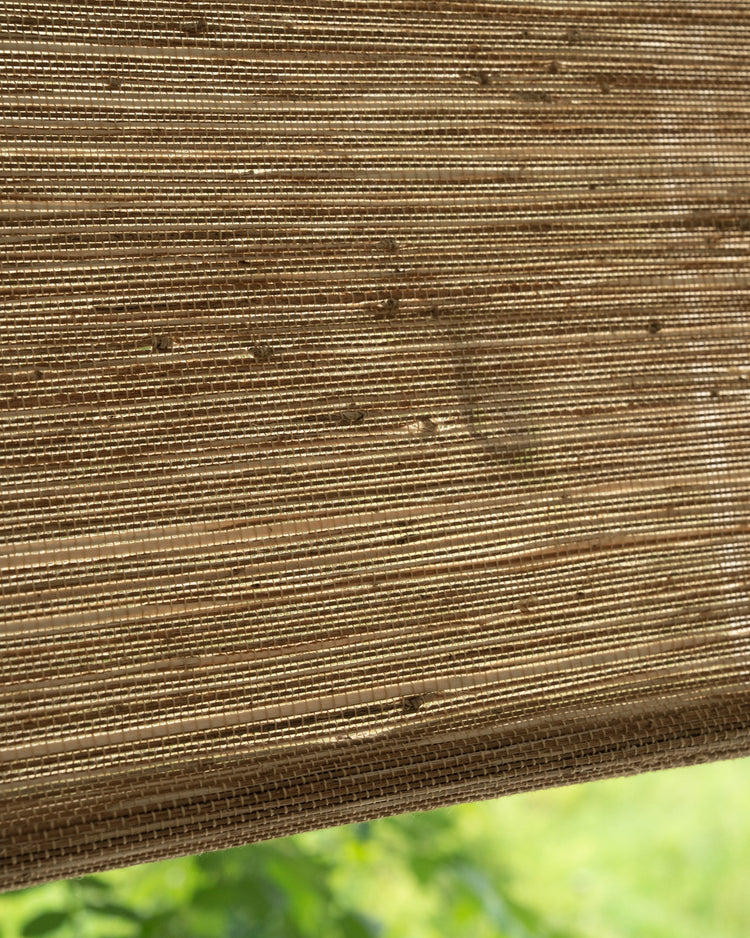 Close-up of Mia Jute Woven Shade in straw, showcasing the tight, textured weave for elegant privacy and light filtering.