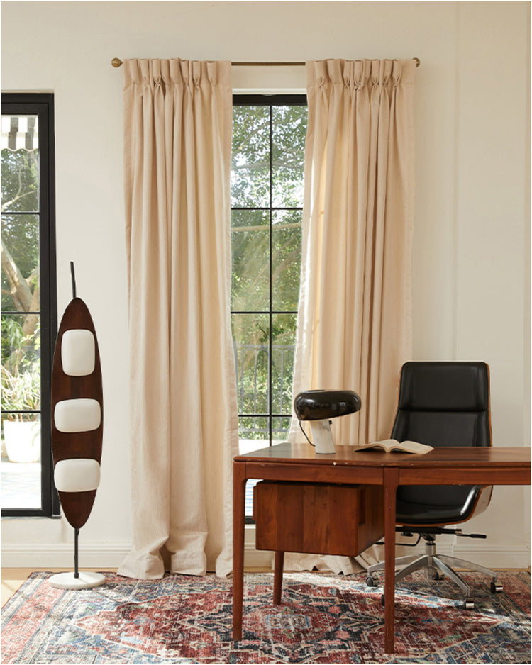 Made-to-measure Tide Linen Blend custom curtains with elegant pinch pleat header, enhancing a high-end, bright home office.
