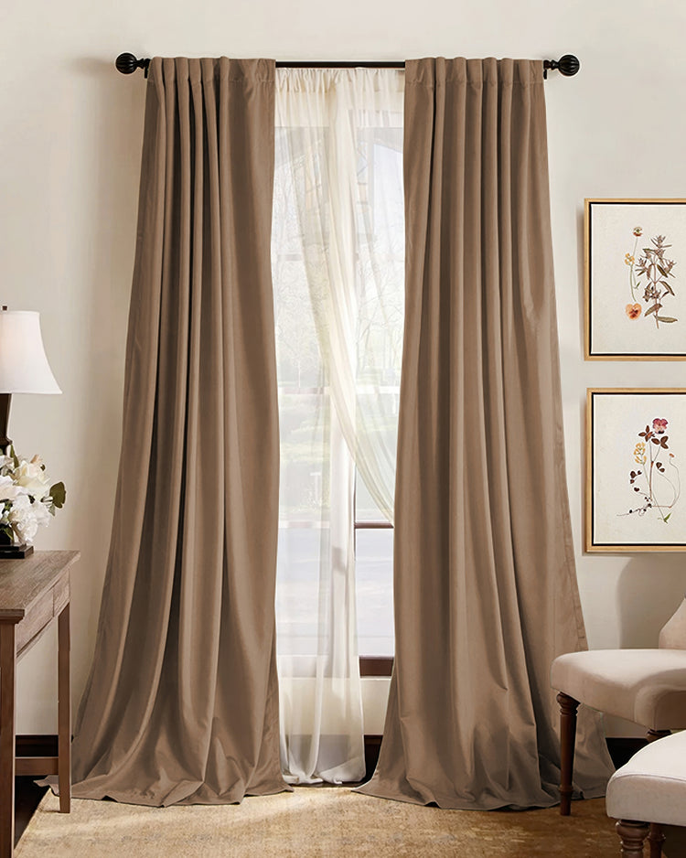 Elegant brown pleated custom blackout curtains layered with sheer drapes, offering sophisticated light control and privacy.