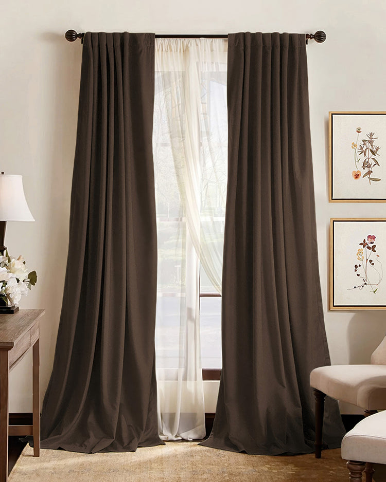 Hussein dark brown 100% blackout custom curtains & sheer drapes, floor-length, enhancing privacy & light control in a living room.