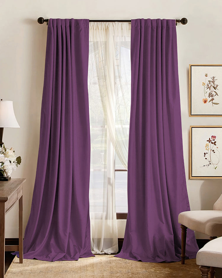 Plum purple custom blackout curtains and sheer drapes on a window, providing thermal, soundproof home decor.