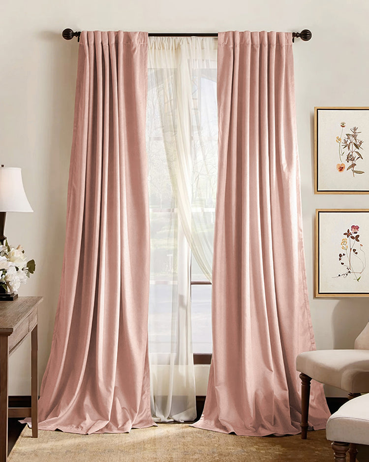 Custom blush pink pleated blackout curtains on a dark rod, layered over sheers, offering soundproof & thermal benefits for sophisticated home decor.