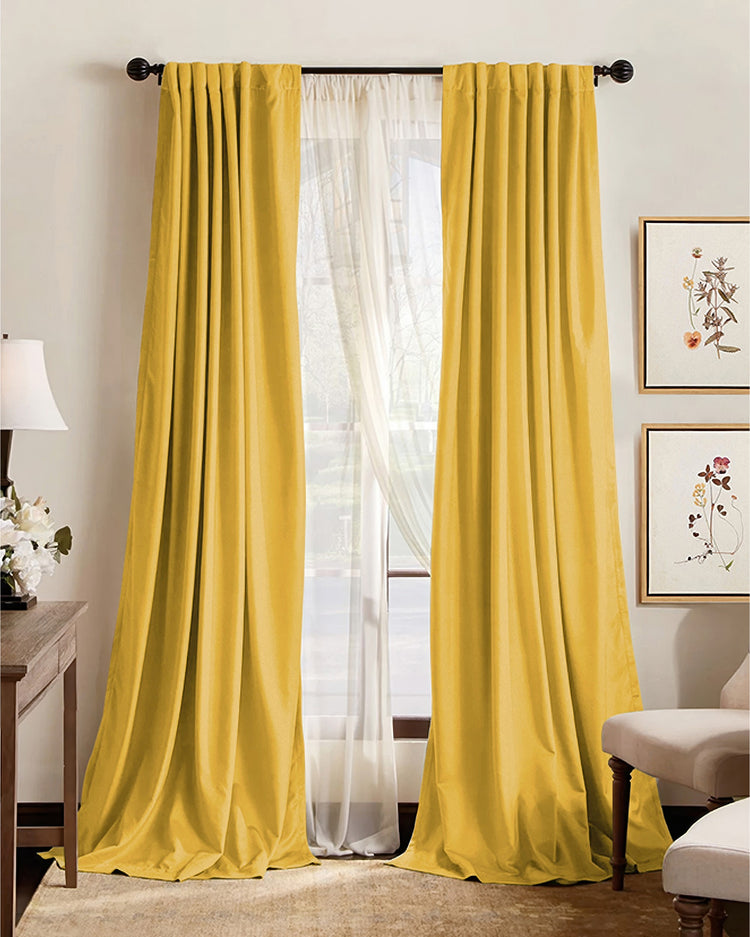 Premium custom yellow blackout curtains with pleated header, layered over sheer drapes, enhancing elegant home decor.