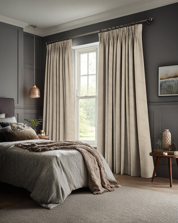 Kensington 100% Blackout OEKO Linen Look custom pinch pleat curtains in light beige, perfectly dressing a bedroom window.