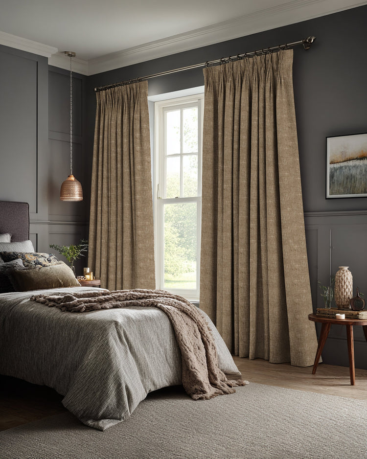 Kensington 100% blackout custom linen-look curtains with tailored pinch pleats, enhancing light control & privacy in a bedroom.