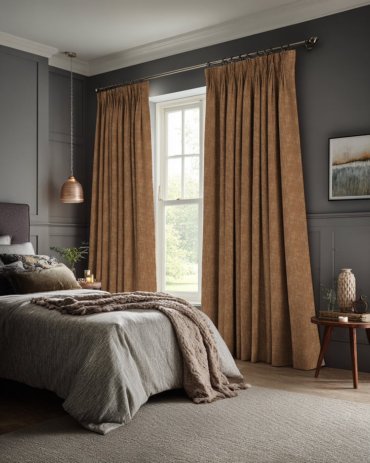 Full-length brown Kensington 100% blackout linen-look custom curtains beautifully frame a bedroom window, offering light control & privacy.
