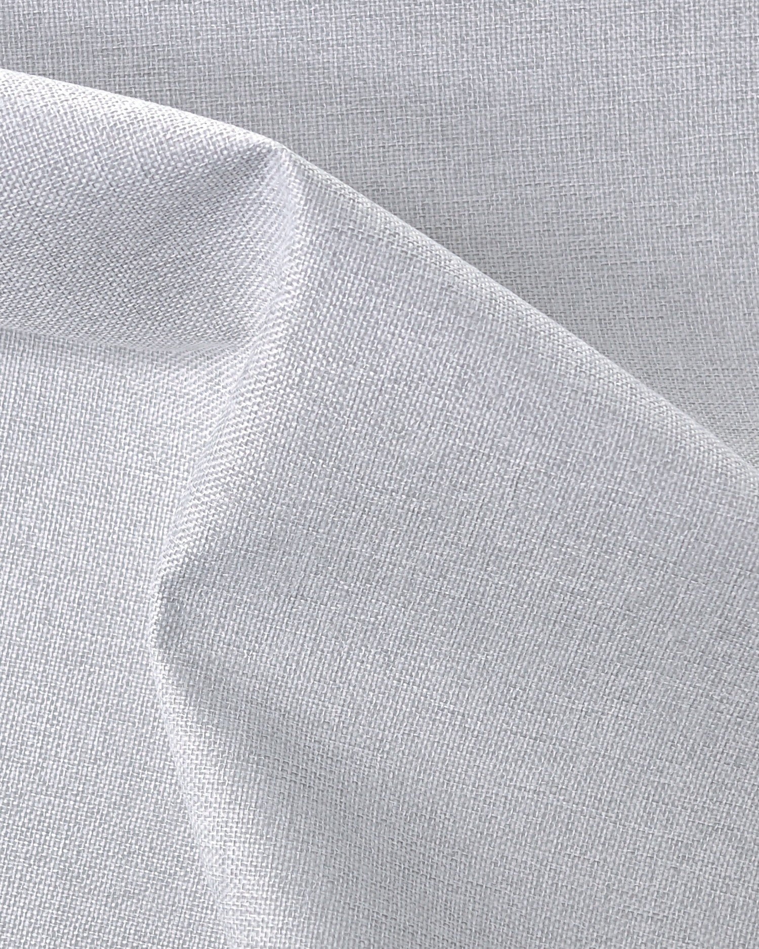 Close-up of Linden NFPA 701 IFR 100% blackout custom curtain fabric featuring a detailed woven linen texture.