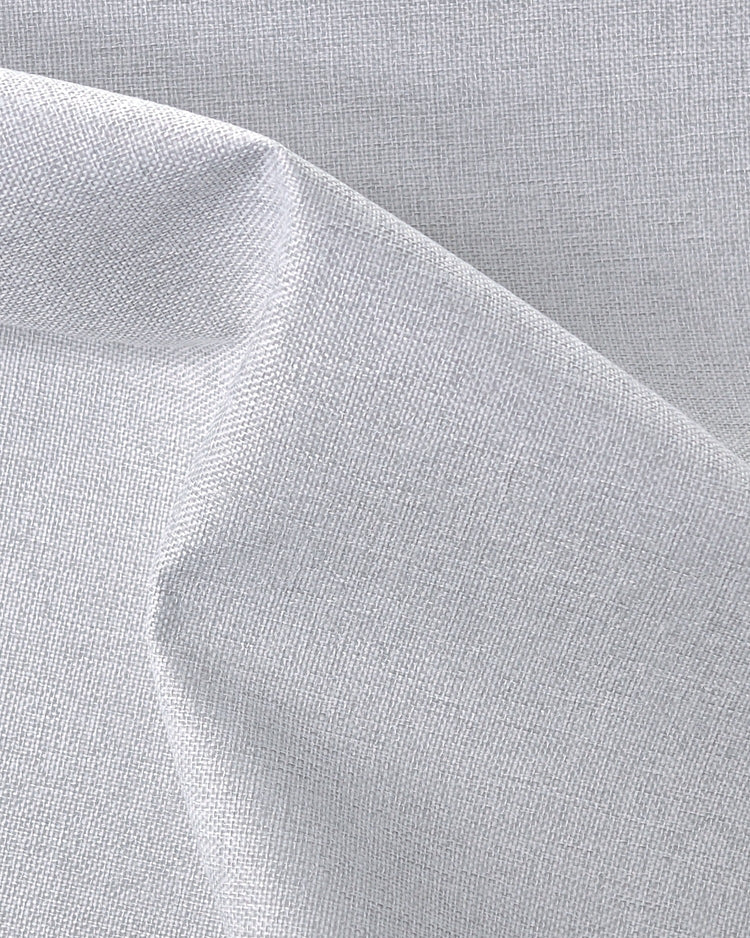 Close-up of Linden NFPA 701 IFR 100% blackout custom curtain fabric featuring a detailed woven linen texture.