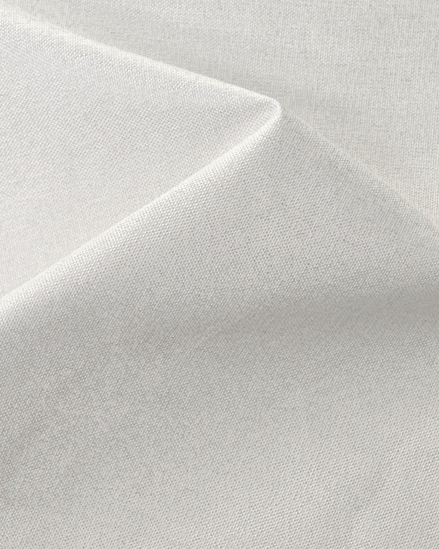 Close-up of white Linden NFPA 701 IFR 100% blackout custom curtain fabric showing a dense, textured linen-like weave.