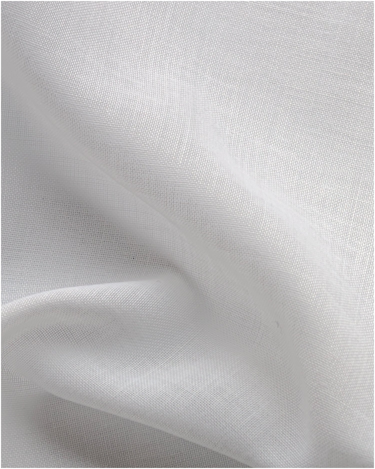 Draped white Sheerra NFPA 701 IFR sheer custom curtain fabric showing the fine, translucent weave and soft texture.