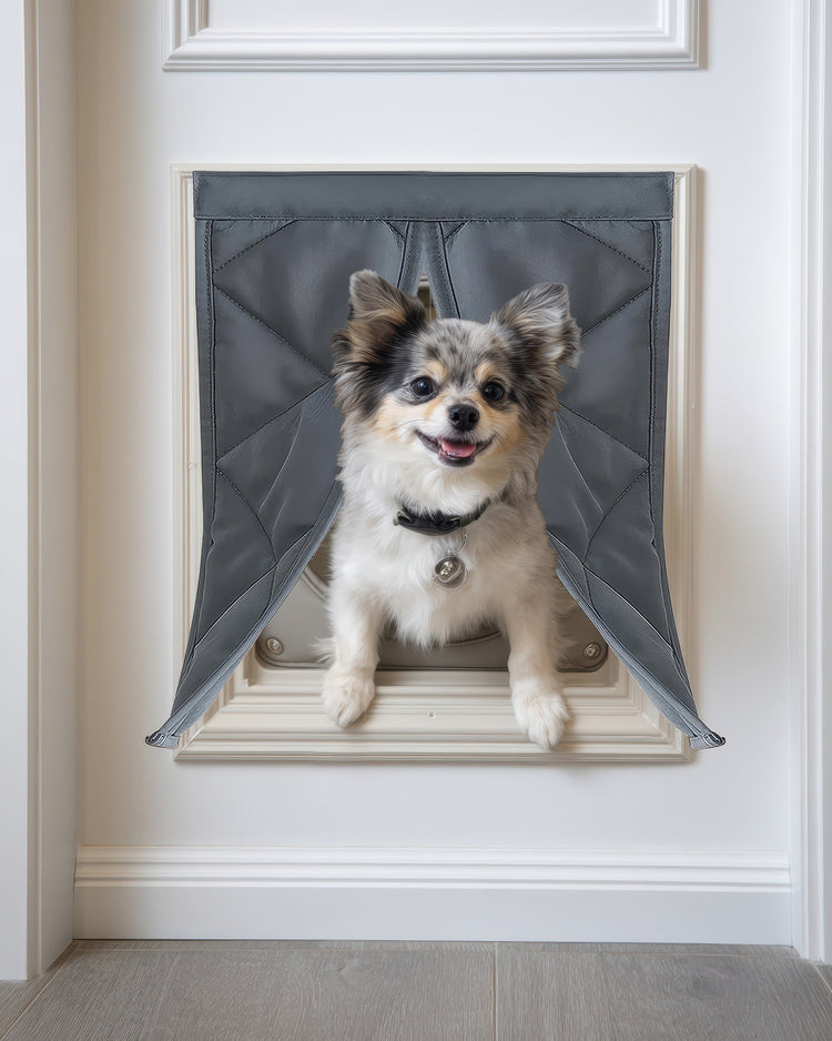 Happy dog exits through a gray quilted Oxford thermal custom pet door cover, ensuring cozy warmth & easy access for pets.