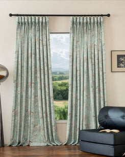 Serene peacock floral linen blend custom drapery in light teal, heavyweight fabric with pinch pleats for window decor.