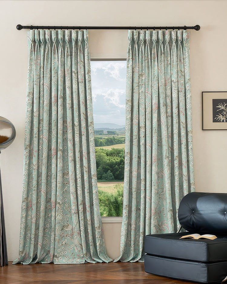 Serene peacock floral linen blend custom drapery in light teal, heavyweight fabric with pinch pleats for window decor.