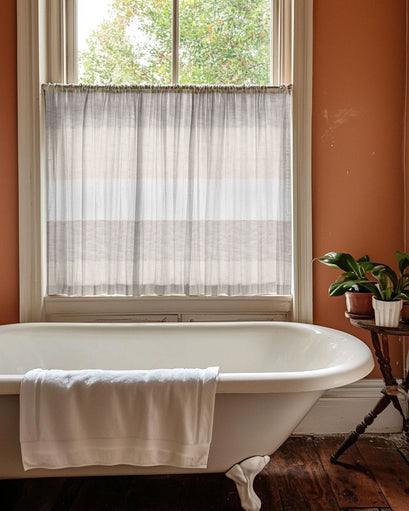 Raw Linen Blend striped patterned semi-sheer custom cafe curtain, neutral tones, offers privacy over a bathroom window & clawfoot tub.