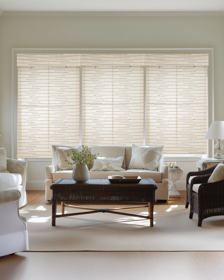 Kaia Linen Bamboo Woven Shades in White cover large windows, offering elegant light control & privacy in a bright living room.