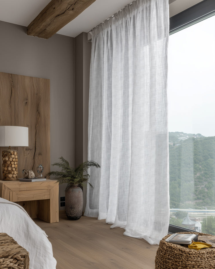 Elegant floor-to-ceiling Tehreem custom sheer curtain with slub texture, creating a serene bedroom retreat with soft light.