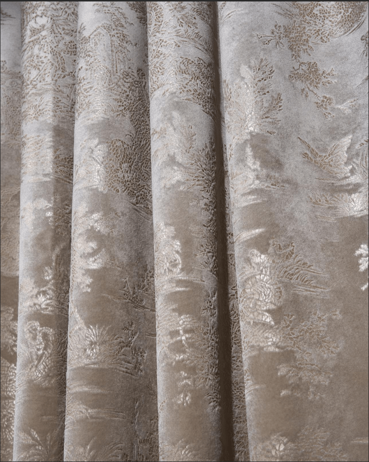 Close-up of taupe Zen foil printed velvet custom curtain with a shimmering metallic nature pattern and soft fabric folds.