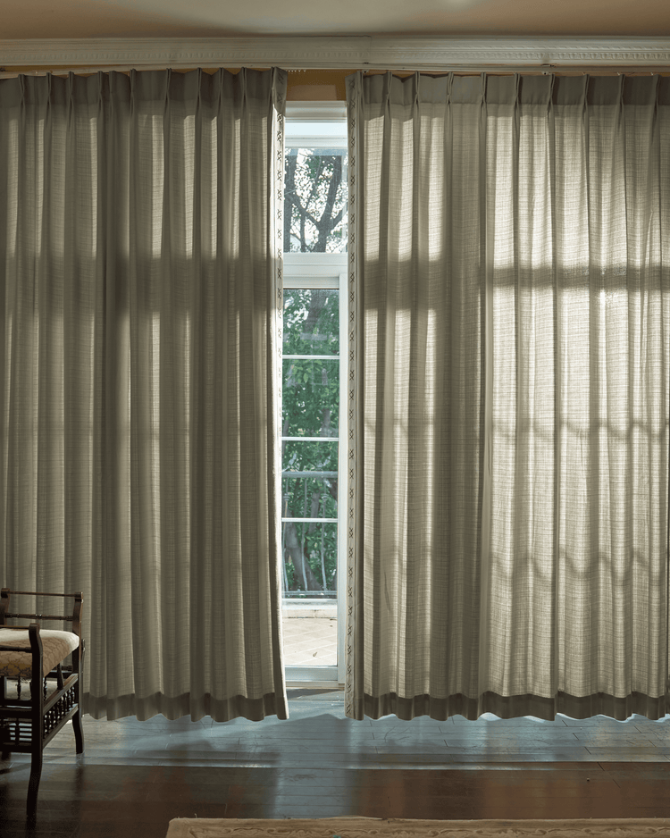 Arden Textured Custom Curtains with elegant trim, filtering light. Neutral ripple fold window treatment enhances home decor.