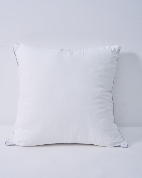 Plush white feather throw pillow insert with subtle leaf pattern and grey piping, for a supportive, naturally full look.