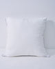 Plush white feather throw pillow insert with subtle leaf pattern and grey piping, for a supportive, naturally full look.