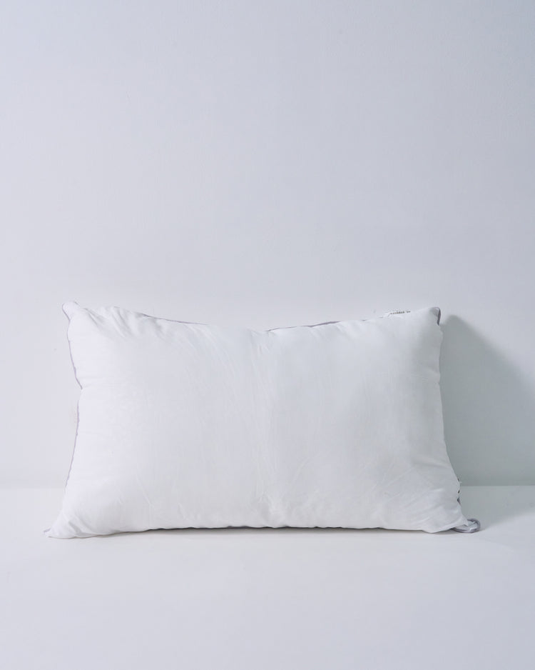 Plush white feather lumbar pillow insert with subtle grey trim, offering a naturally full and supportive look.
