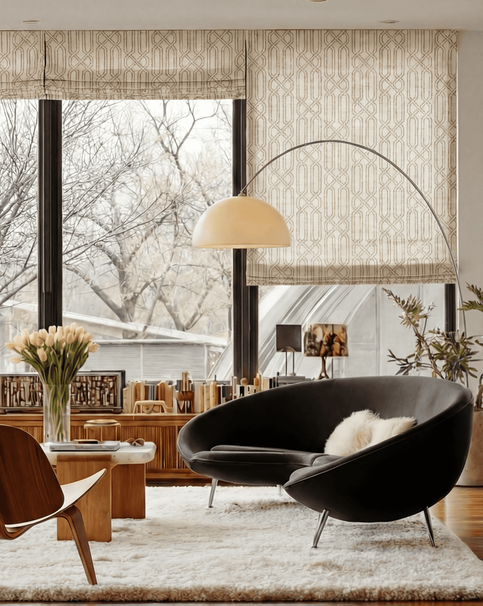 Interlace geometric linen blend roman shades in a modern room with a black curved chair and large arched floor lamp.