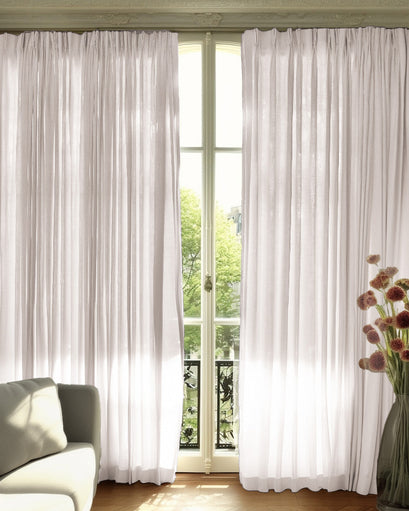 Sophisticated Cassie Linen Blend custom curtains, floor-length, with refined pleats on a tall window for light filtering & privacy.