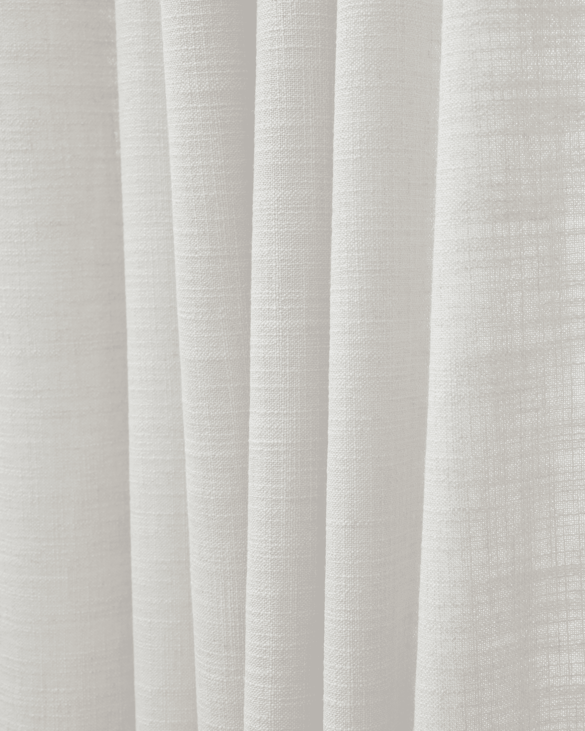 White textured Cassie linen blend fabric swatch, highlighting its natural weave and soft folds for custom window treatments.