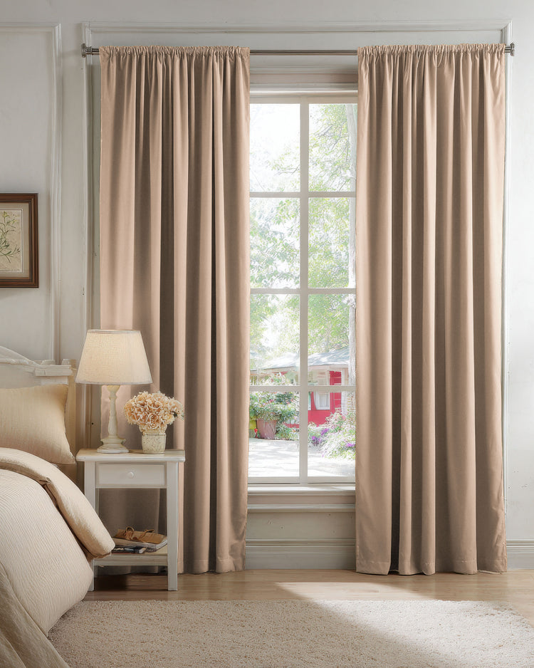 Classic beige 100% blackout velvet custom curtains open at a bright bedroom window, enhancing light control and elegant home decor.