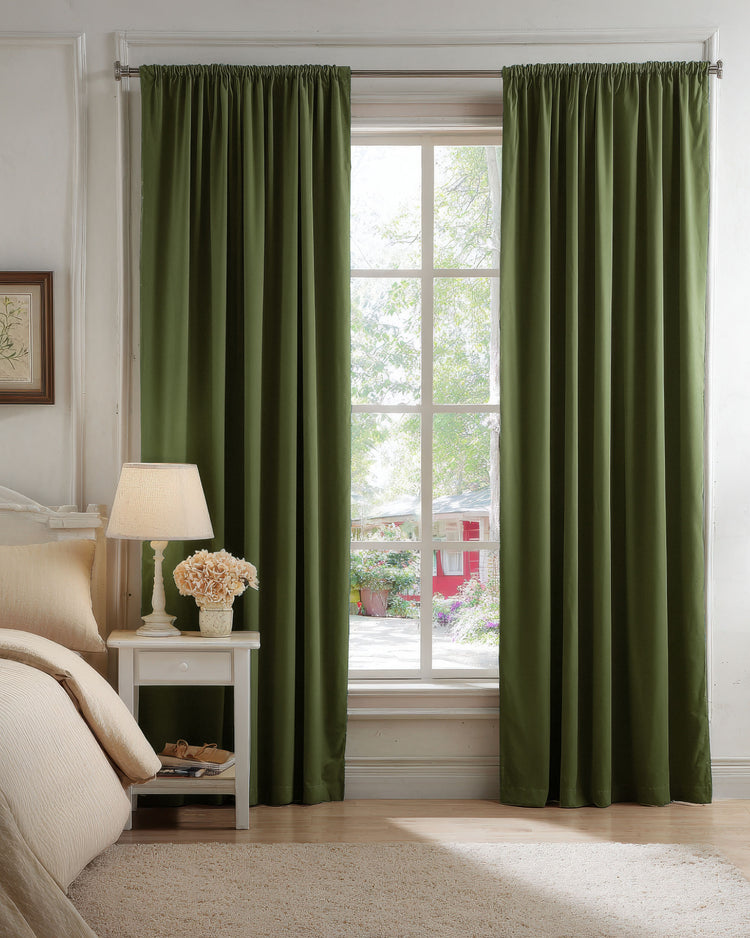 Classic olive green 100% blackout velvet custom curtains with a rod pocket header, stylishly framing a bedroom window.
