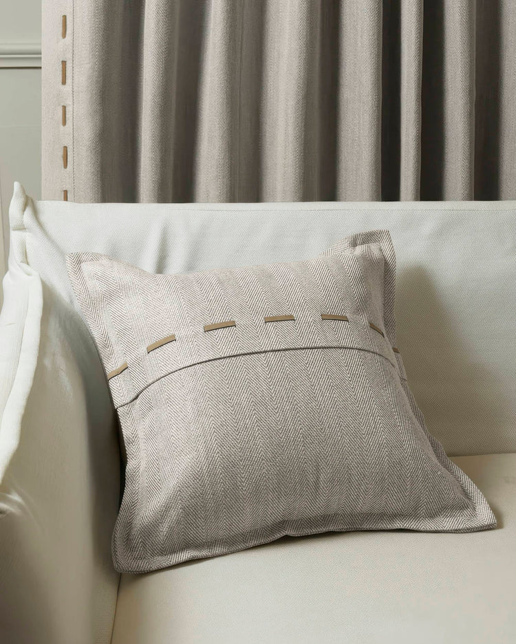 Cleo textured faux leather laced throw pillowcase with chevron pattern, displayed on a sofa with coordinating custom drapery.