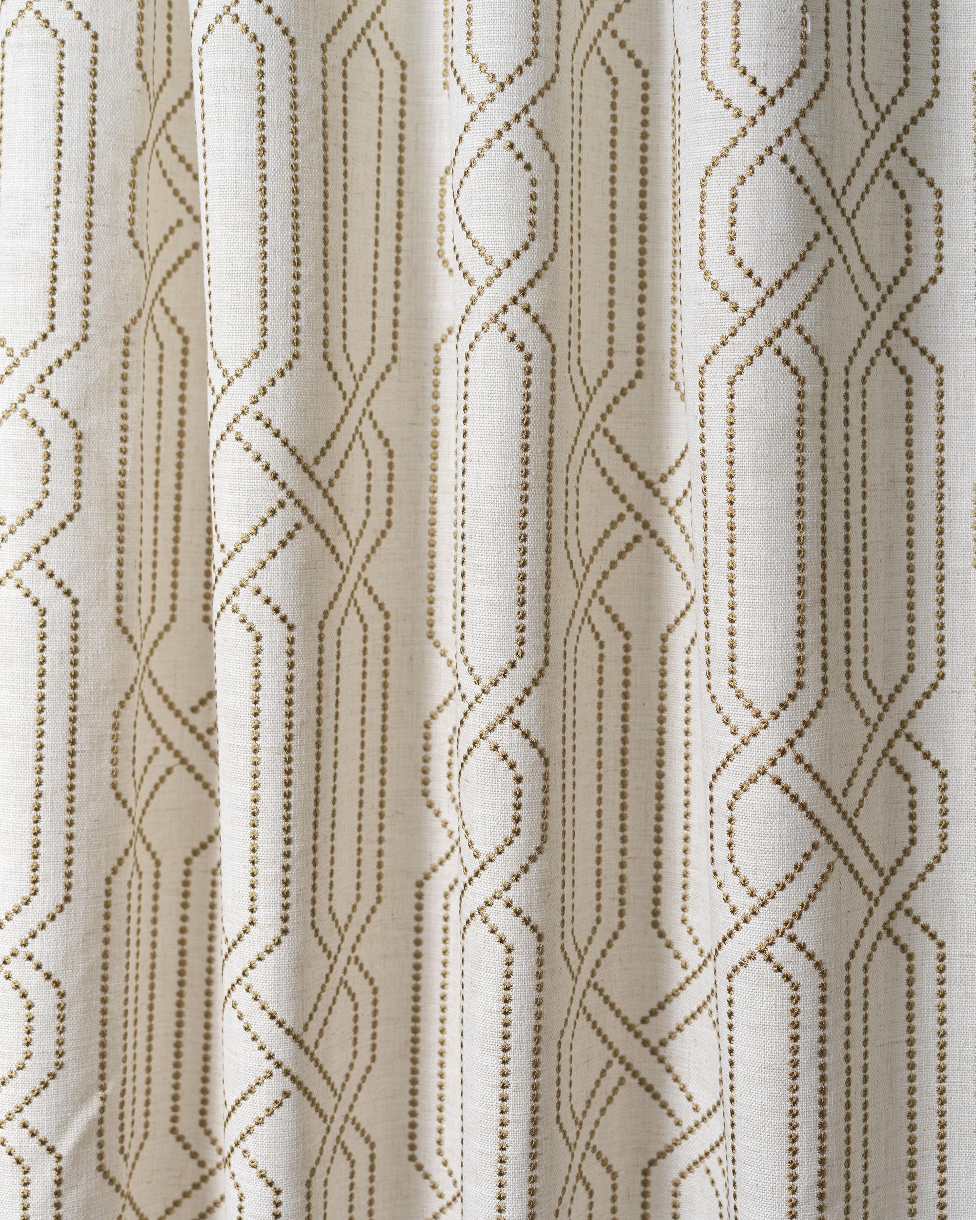 Close-up of Interlace linen blend fabric swatch showing gold dotted geometric embroidery for custom window treatments.