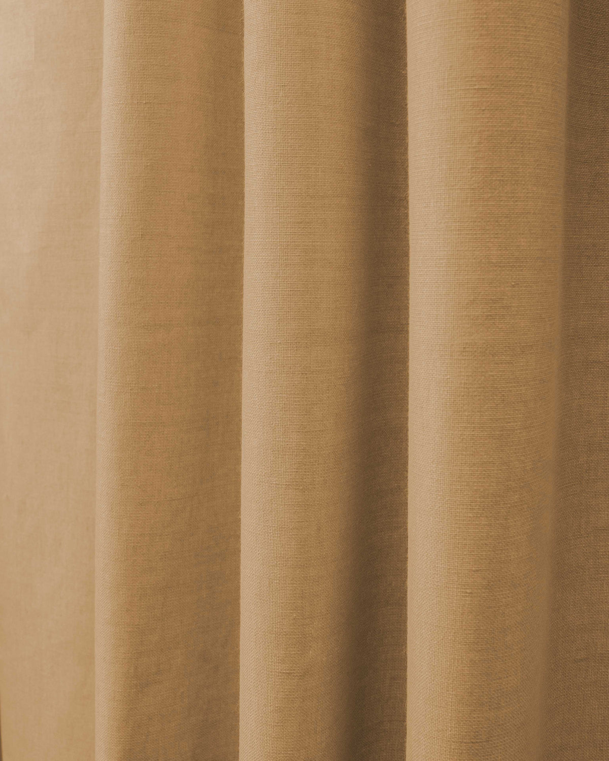 Natural tone Cronin Linen Look Custom Blackout Curtain fabric with detailed texture and elegant pleats for sophisticated window treatments.