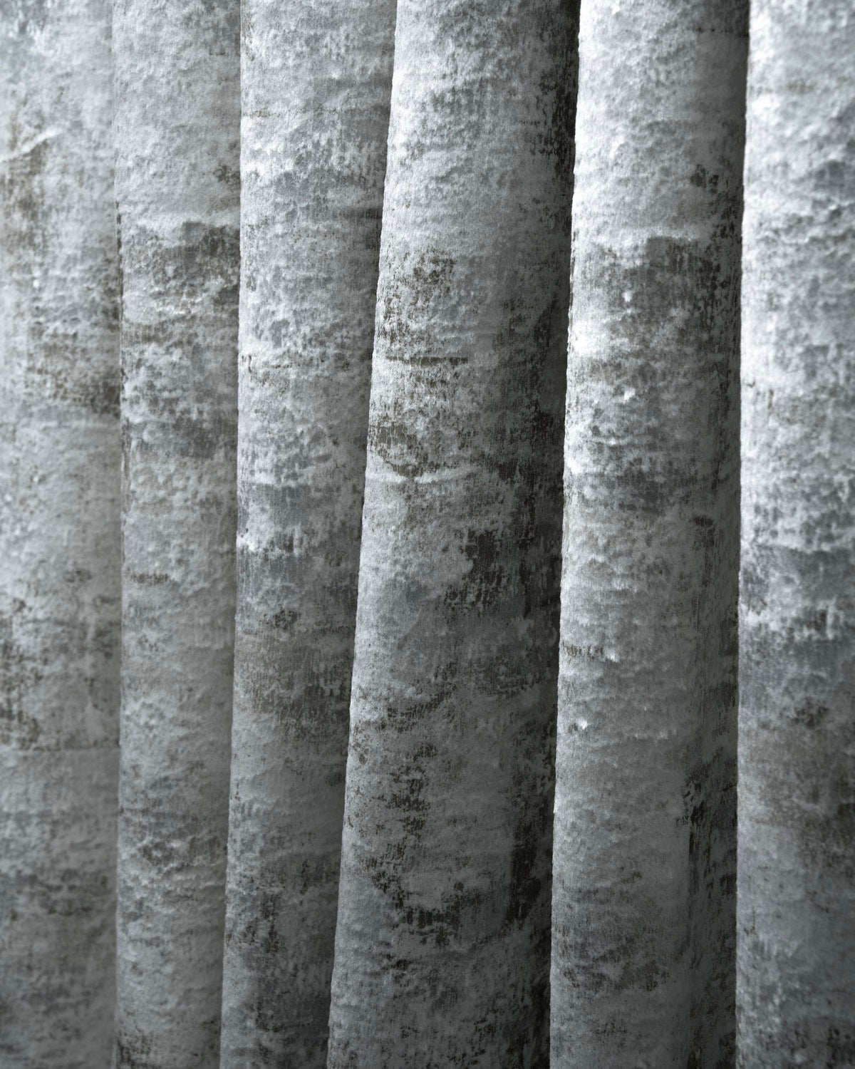 Silver-grey Impression Foil Printed Velvet custom drapery, featuring its unique abstract pattern and luxurious texture.