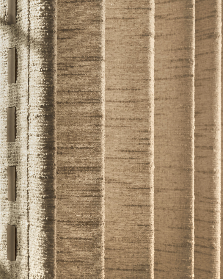 Close-up of Juliette wool blend custom curtain, highlighting its luxurious textured fabric with a thick slubbed weave & elegant trim.