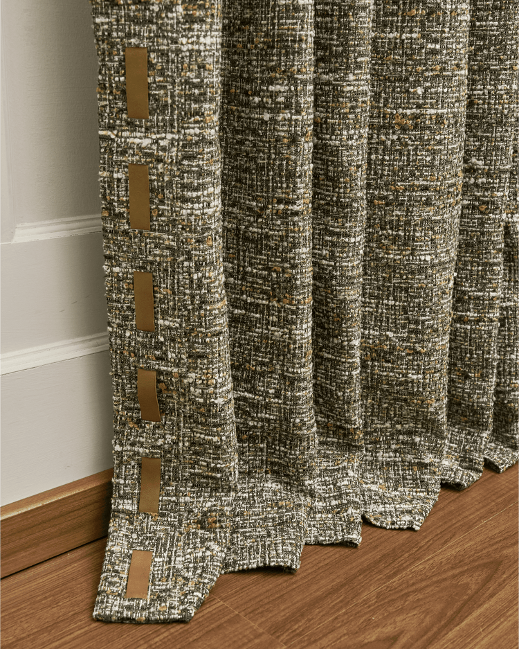 Juliette wool blend custom green textured curtain with tan vertical trim detail. Close-up of elegant made-to-measure drapery fabric.