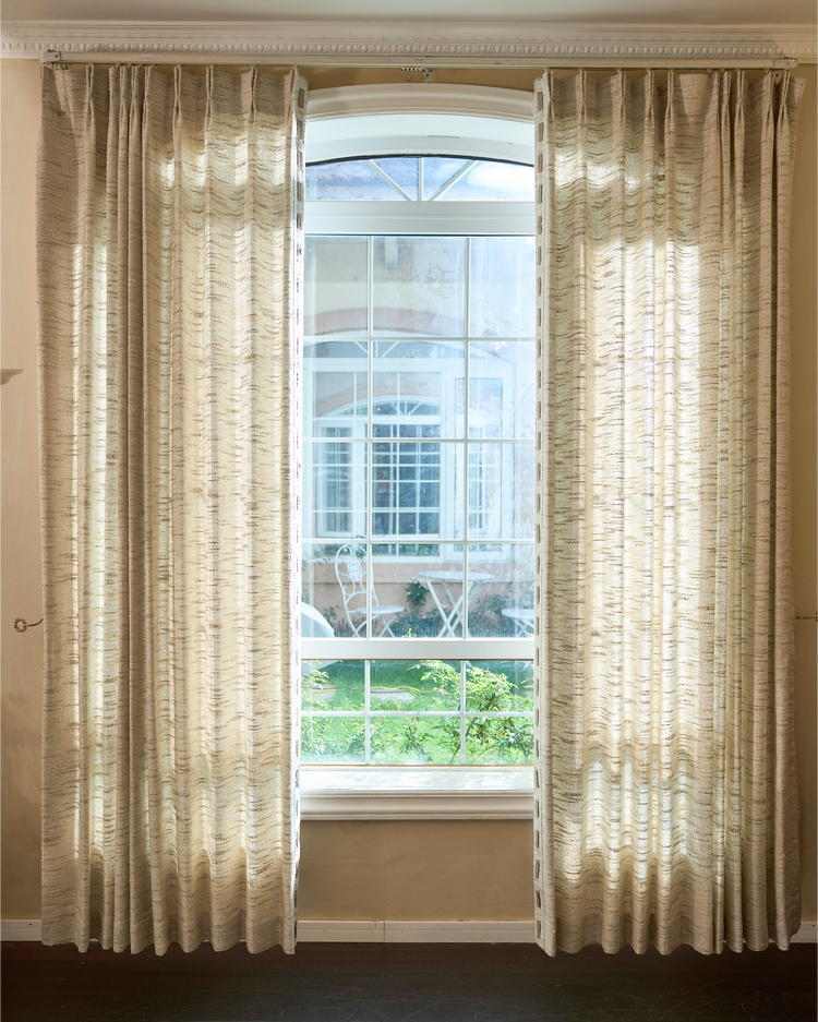 Juliette wool blend textured custom curtains with faux leather trim, bringing warmth and sophistication to home decor.
