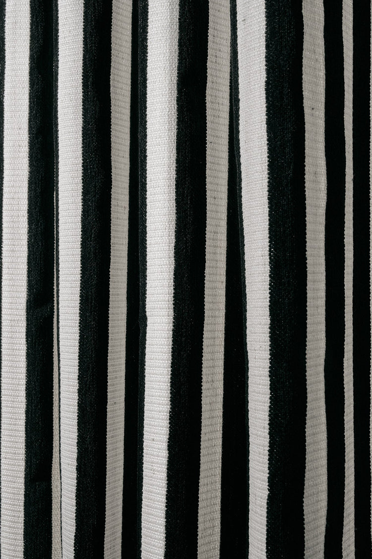 Textured Liam & Renee vertical stripe fabric swatch in bold black and white, ideal for custom made-to-measure drapery.