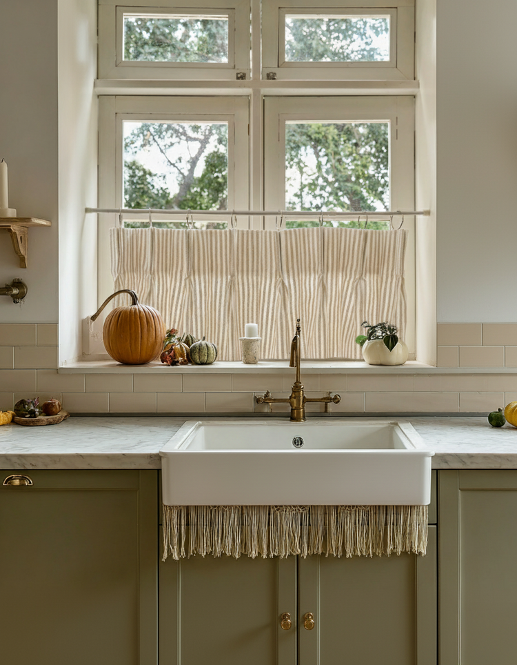 Textured Milo Linen Blend Striped Custom Cafe Curtain over a kitchen sink, providing privacy with elegant light stripes.