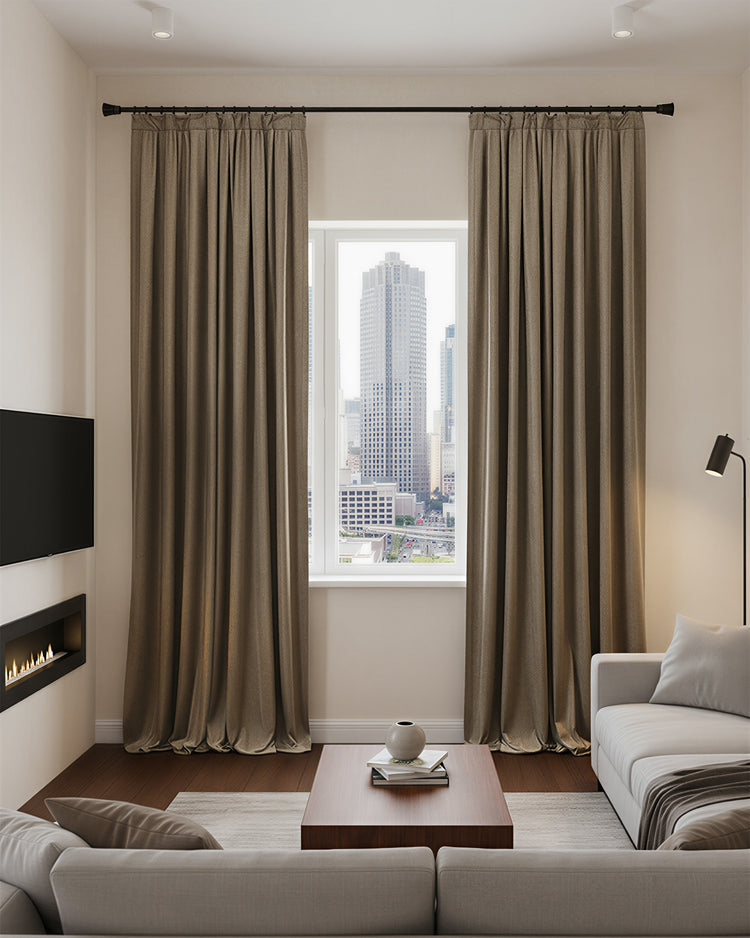 Floor-to-ceiling brown velvet blackout custom curtains in a modern living room, demonstrating luxurious thermal and soundproof drapery.