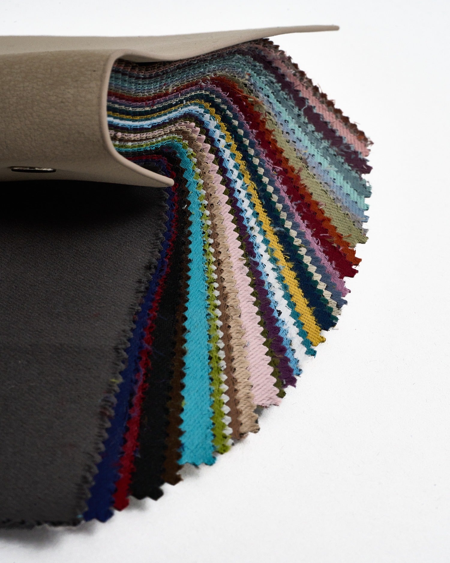 Hussein OEKO Certified fabric swatch book featuring 27 colorful samples with pinked edges for custom home drapery.