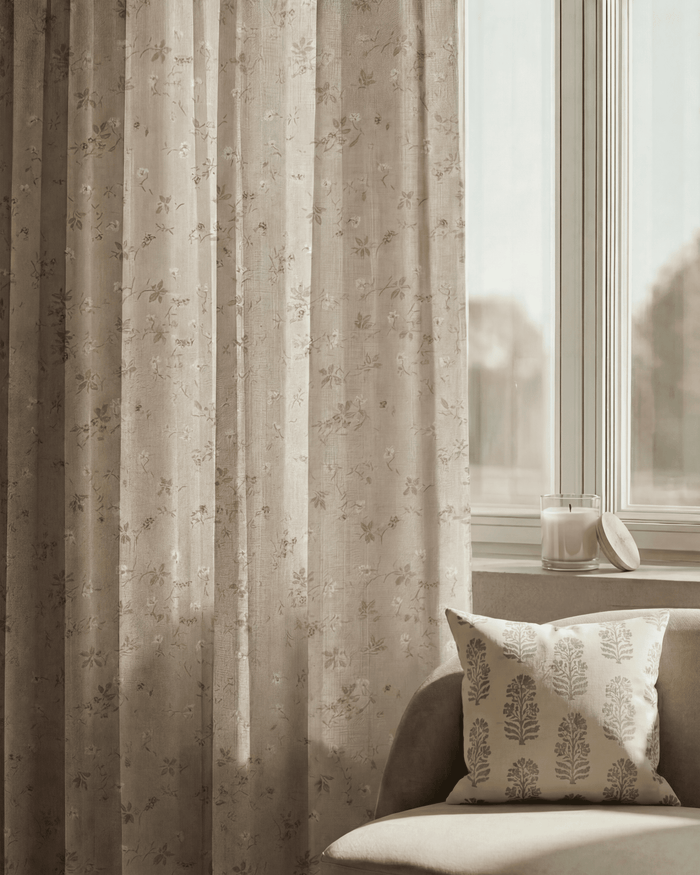 Whisper Linen Blend floral patterned custom curtain with textured linen fabric hanging by a window in a neutral room.