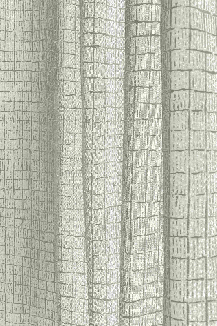 Close-up of TheHues' custom outdoor curtain fabric, showcasing its light beige color and textured New York Grid pattern.