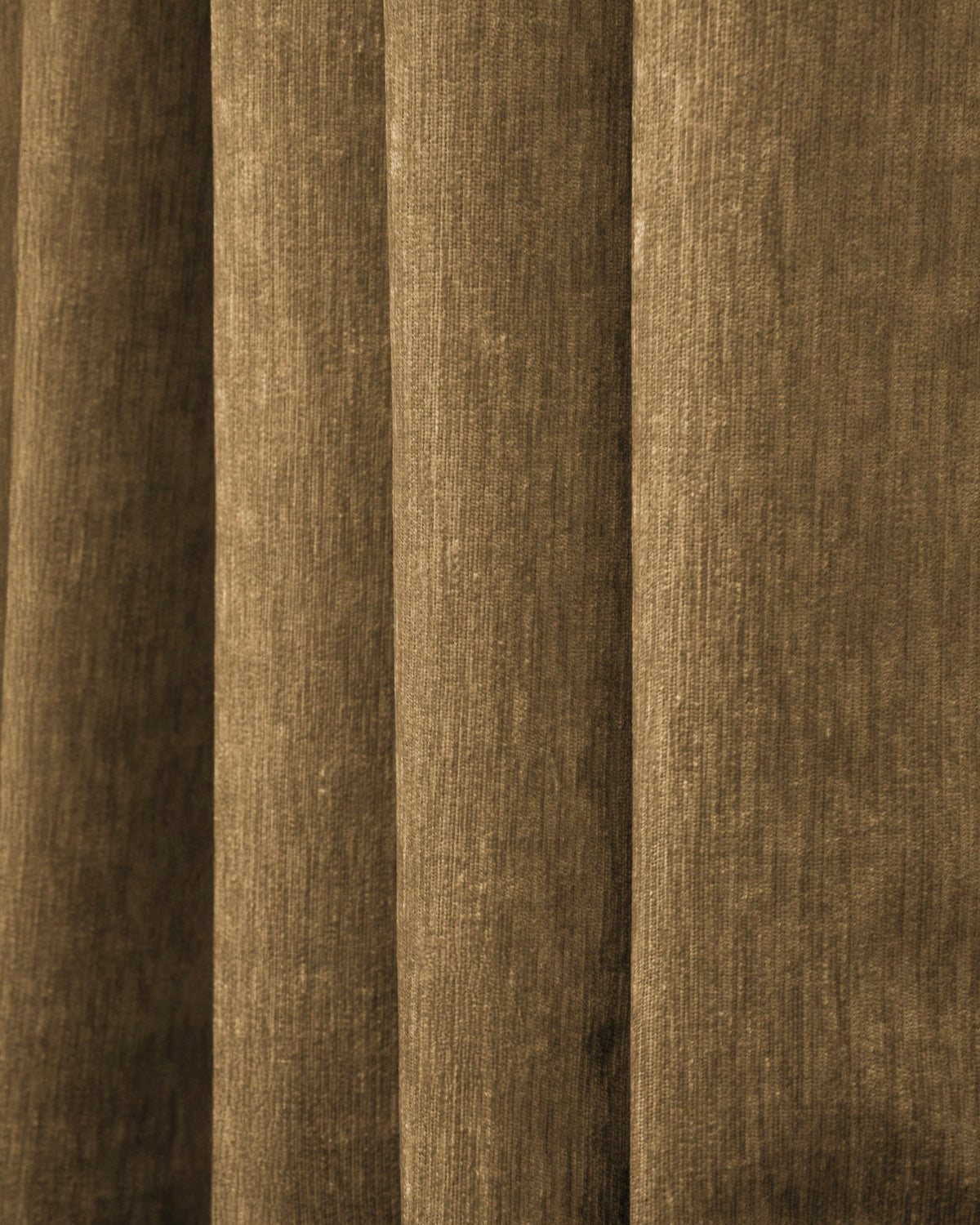 Close-up of rich brown Quinn Blackout Heavyweight Velvet custom curtain fabric, highlighting its luxurious texture and dense folds.