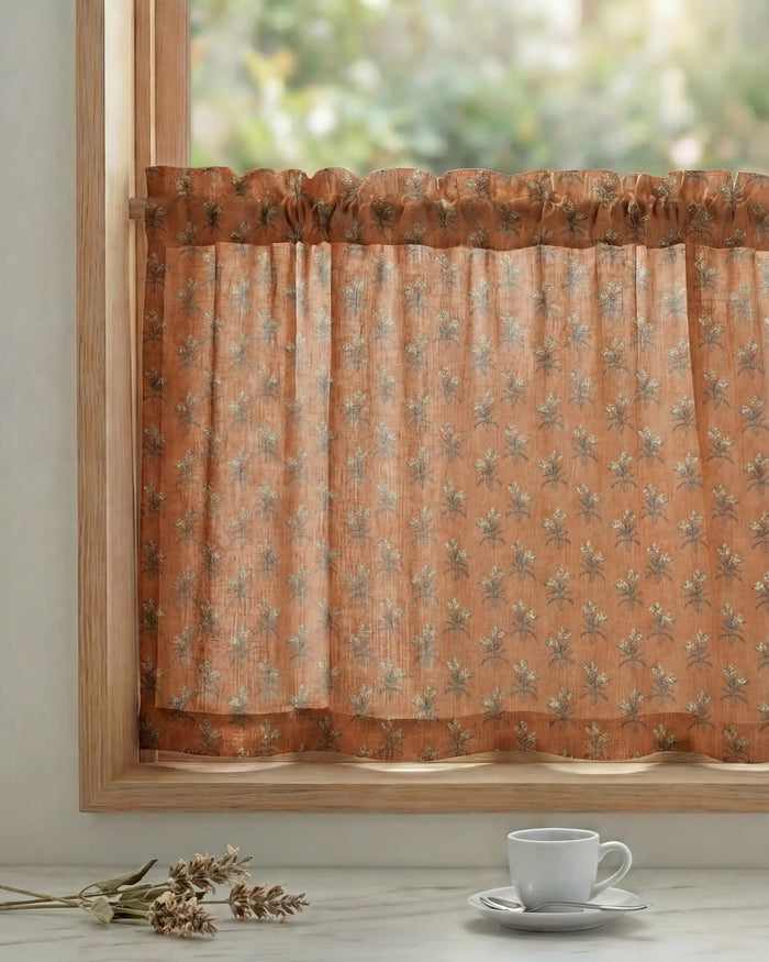 Terracotta Rhythm floral patterned custom cafe curtain with a rod pocket header on a light wood kitchen window frame.
