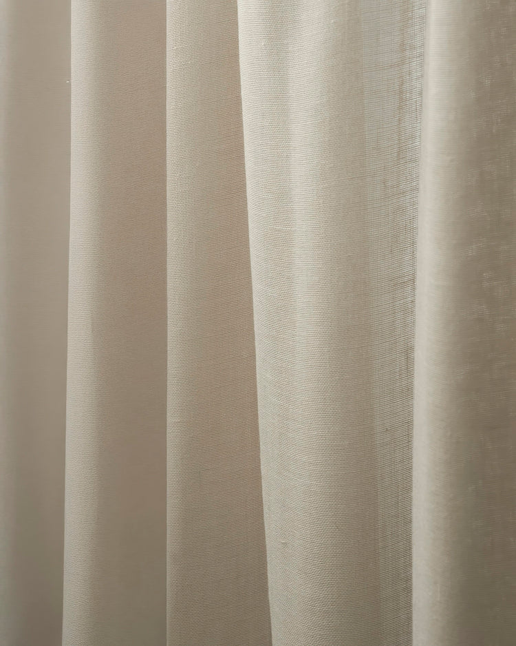 Light beige custom outdoor sheer curtain with a subtle linen-look texture and soft, lightweight drape.
