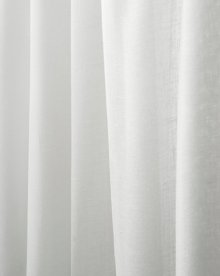 Close-up of white Sabrina linen look lightweight outdoor sheer curtain fabric, highlighting its subtle texture and soft folds.