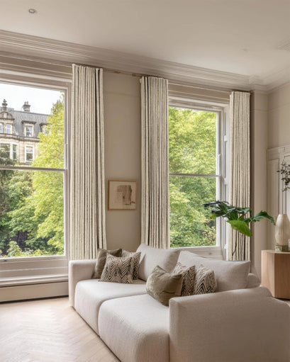 Sahara 100% blackout linen blend patterned custom drapery in a sunlit living room, ensuring complete light control.